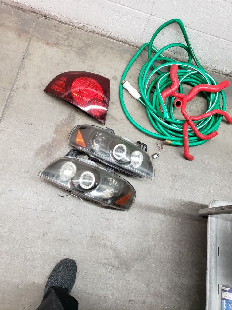 2005 nissan sentra taillights and 02-03 headlights 100 takes all