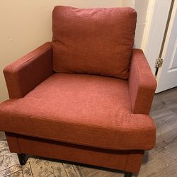 Comfortable accent chair in a warm inviting orange color
