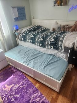 Twin Bed With a Pull Out Bed Under It