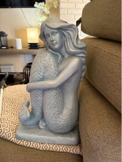 Ceramic mermaid statue