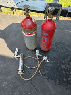 Two C02 tanks and parts for a keg cooler
