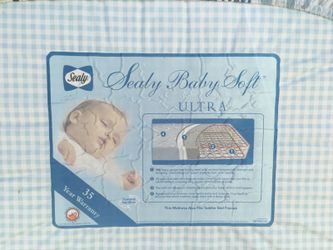 Crib Mattress in great condition with waterproof mattress cover and crib sheet