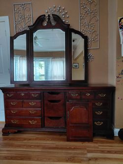 Solid wood dresser with tri-fold mirror