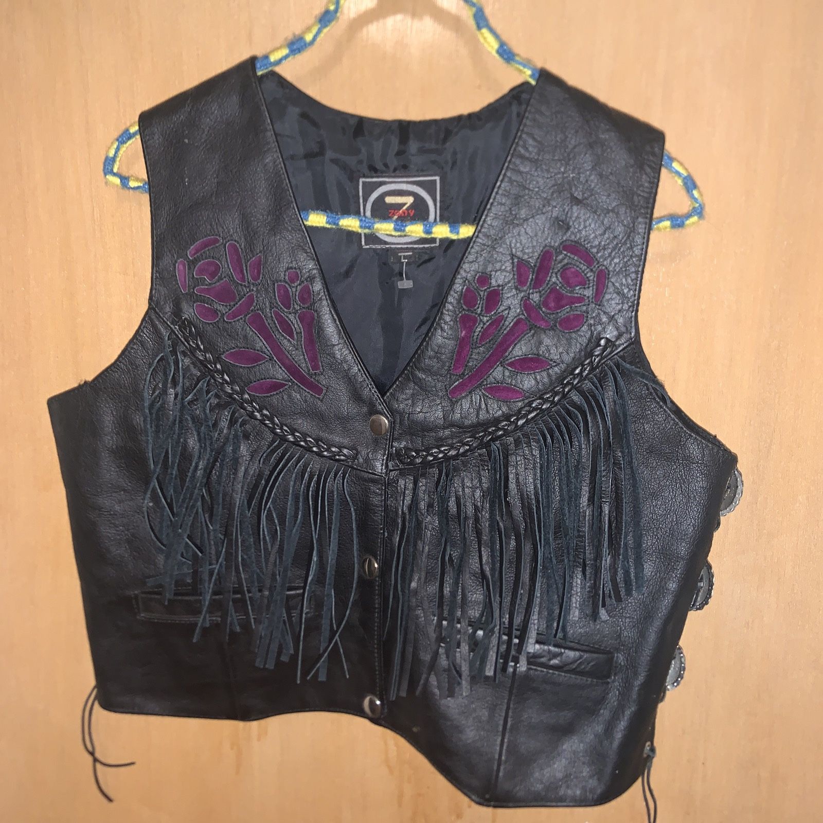 Woman’s Leather Vintage Vest With Fringes Embroidered With Concho Accents 