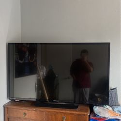 Flat Screen TV  28height Width45
