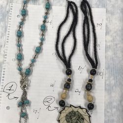 used womans neckles. with charms