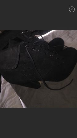 Pair of quilted black chunky-heeled suede shoes