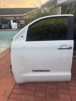 LEFT DRIVER SIDE FRONT DOOR 2014 TOYOTA TUNDRA(WHITE) WITH HINGES SMALL DENT.