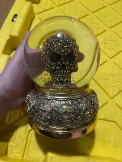 Christian Lacroix Halloween gold abstract skeleton skull water globe In great condition About 7" tall Bottom diameter 4.75"