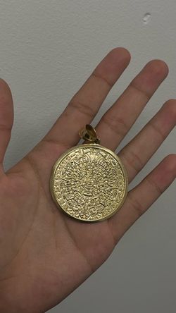 14 karat gold aztec pendant
