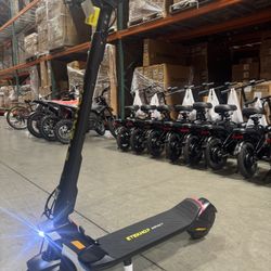 Front and rear shock-absorbing electric scooter