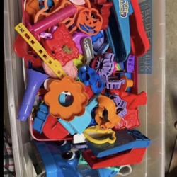 Large assortment of cookie cutters and Play-Doh vacuum cleaner