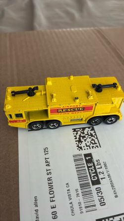 vintage 1979 Hot Wheels Airport Rescue fire truck, a yellow diecast model based on the Oshkosh P-15 ARFF crash truck.