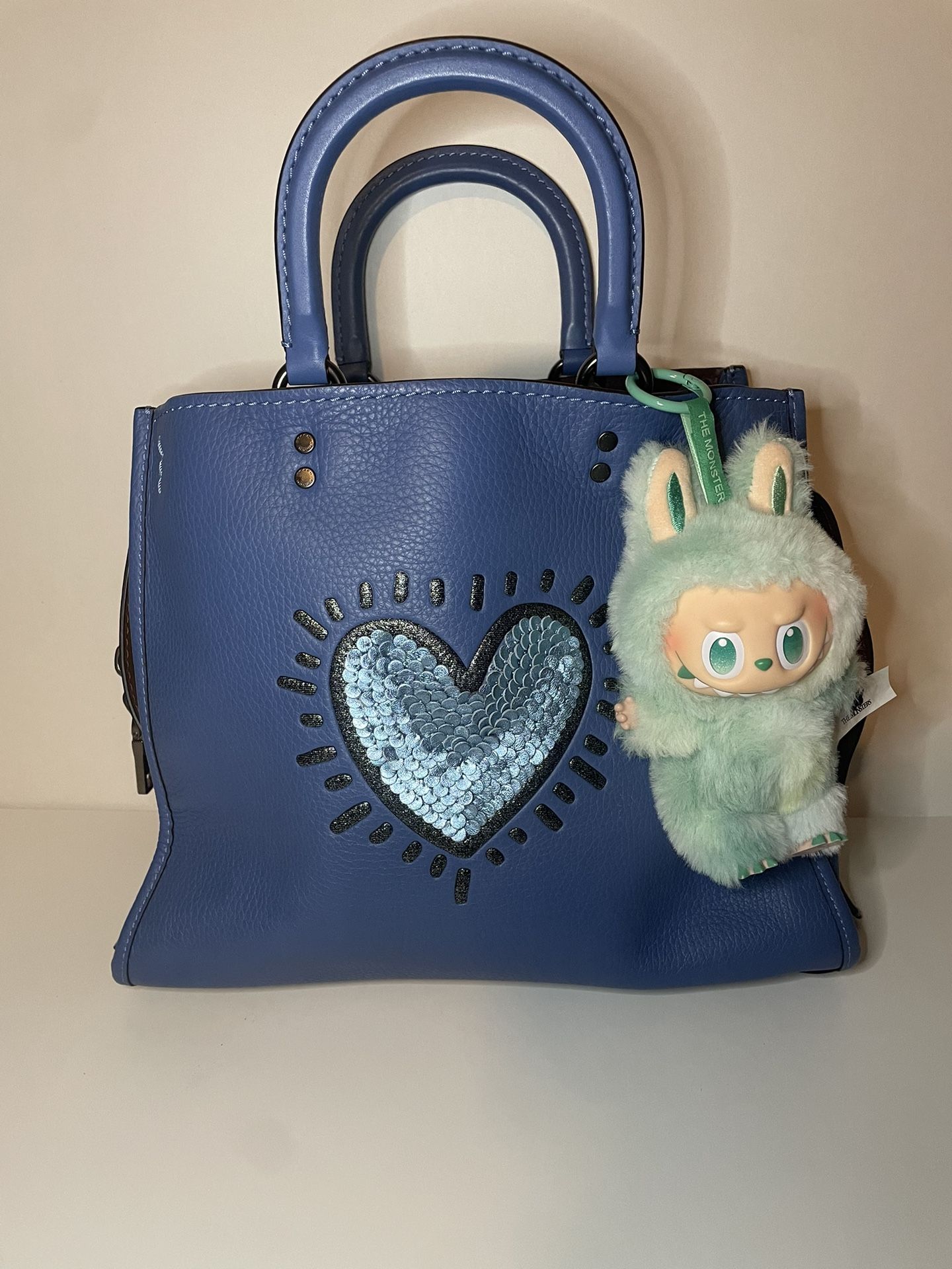 Coach X Keith Haring Blue Pebble Leather Sequin Heart Rogue Sachel Purse Gorgeous preloved condition with slight markings on handbag feet Labubu n