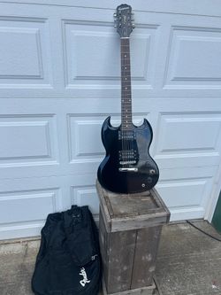 Epiphone Special SG model guitar in excellent cond. w/gig bag. Plays very well for a medium quality guitar, holds its tune. Great for a beginner witho