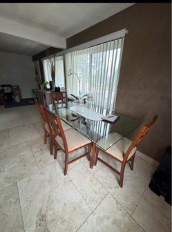 Glass Dining Table + 6 Chairs – $150