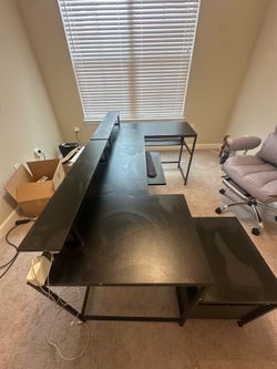 Office desk with outlets and filing cabinets