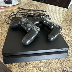 PlayStation 4 Slim W/ 2 Controllers