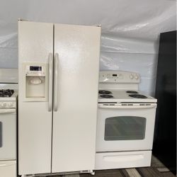 GE side-by-side refrigerator super clean with matching GE coil top stove