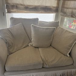 Cozy Beige Loveseat with Pillows – Good Condition