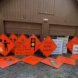 Bunch of Big Heavy Duty Reflective Road Traffic Construction Work Signs