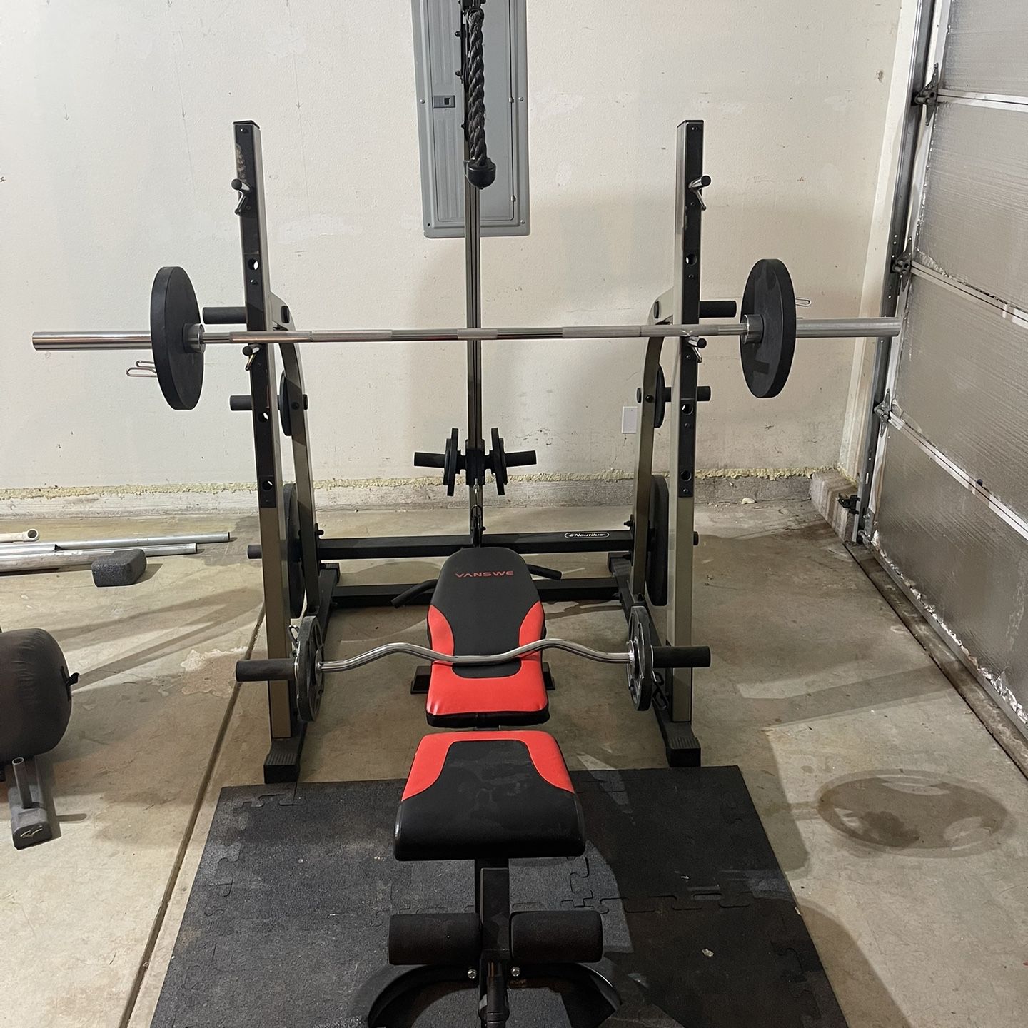 Squat Rack, Bench Bar And Weights 