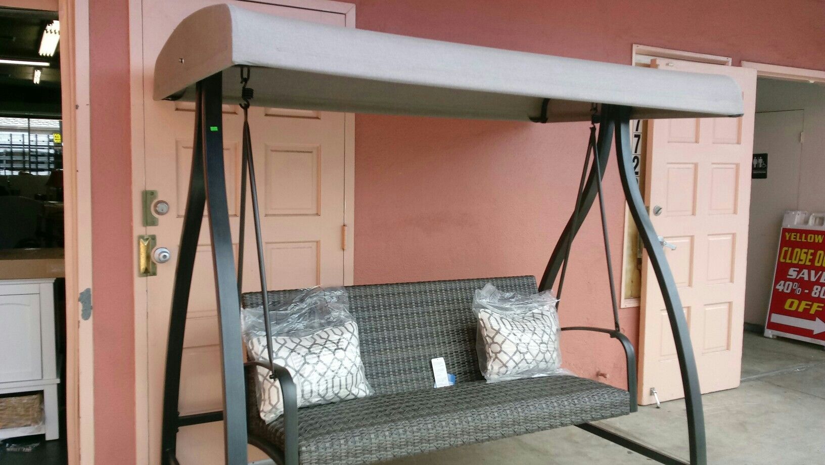 Agio Eastport Woven Swing with Canopy and Two Decorated Accent Pillows Approx.