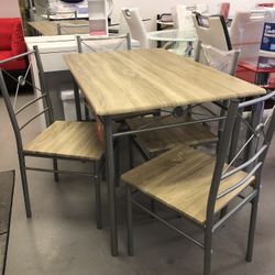 New Dining Set .table And 4 Chairs .Visit Us at 5513 8th Street W Suite 10 Lehigh .we Finance initial Payment $39.Same day Deliver Available 