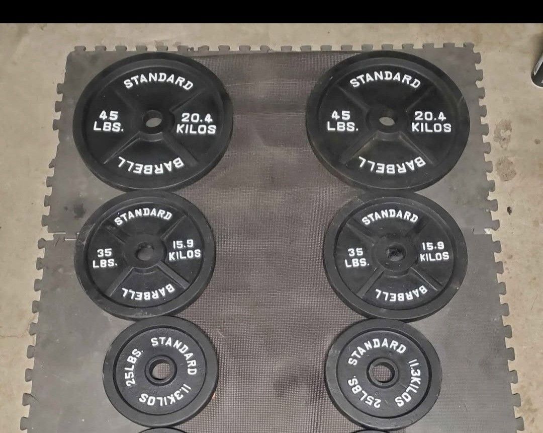 Olympic Weight Set Includes 2x45lbs 2x35lbs 2x25lbs Thats 210lbs all together selling all for $225..