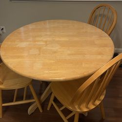 Wooden dining table with 3 chairs