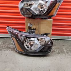 Pair of Headlight Assemblies Compatible With Ford Transit 150 (contact info removed)-2023 Black Amber