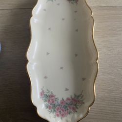 This is a Lenox Petite Rose oval relish dish in ivory porcelain with gold trim