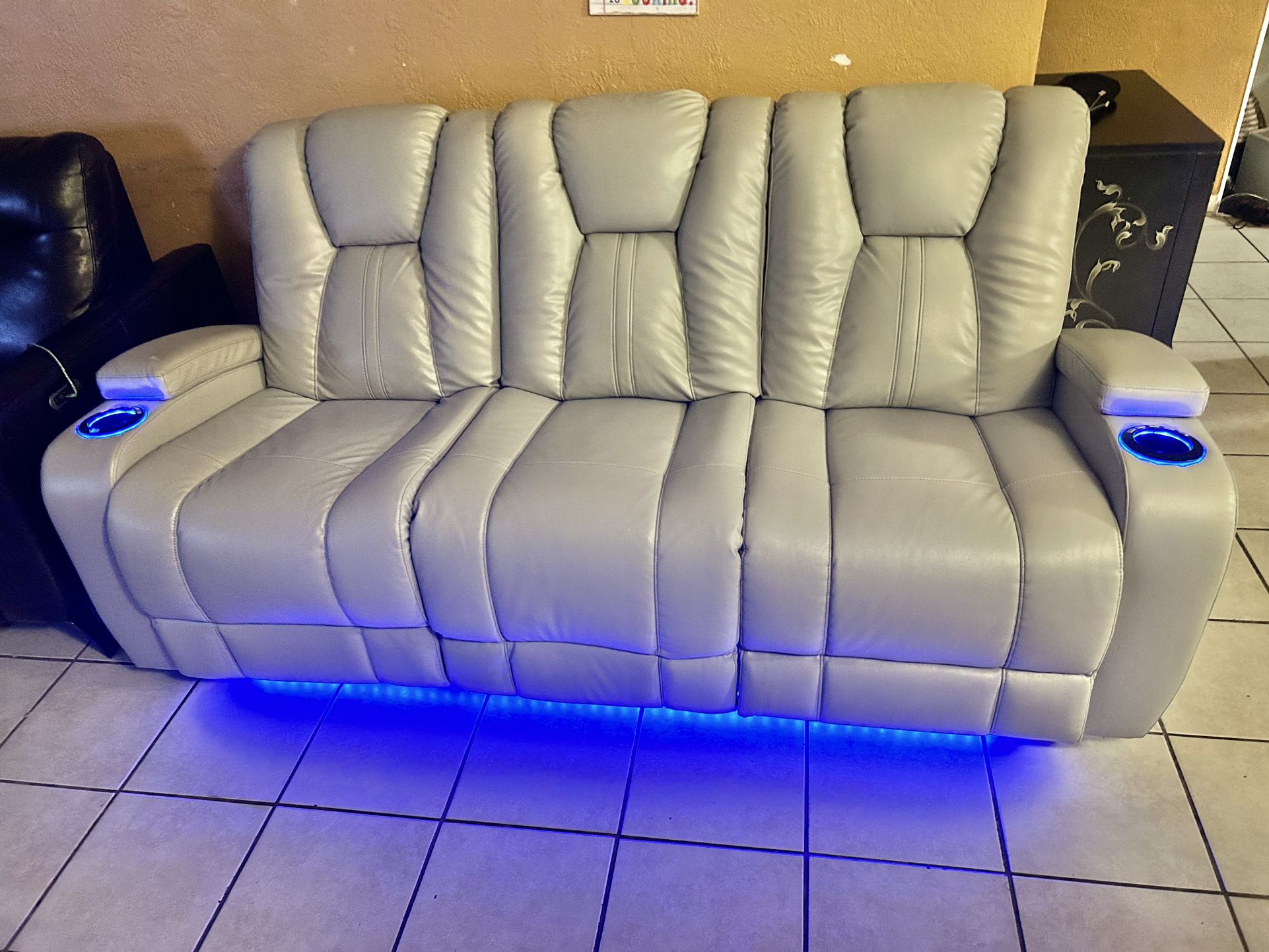 Like New Leather Electric Dual Reclining Couch With Electric Headrests And Dual USB And Led Lighting 