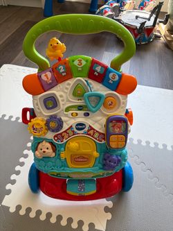 Children’s walker ride on toy rocker shelf storage