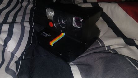 Polaroid Now + black camera