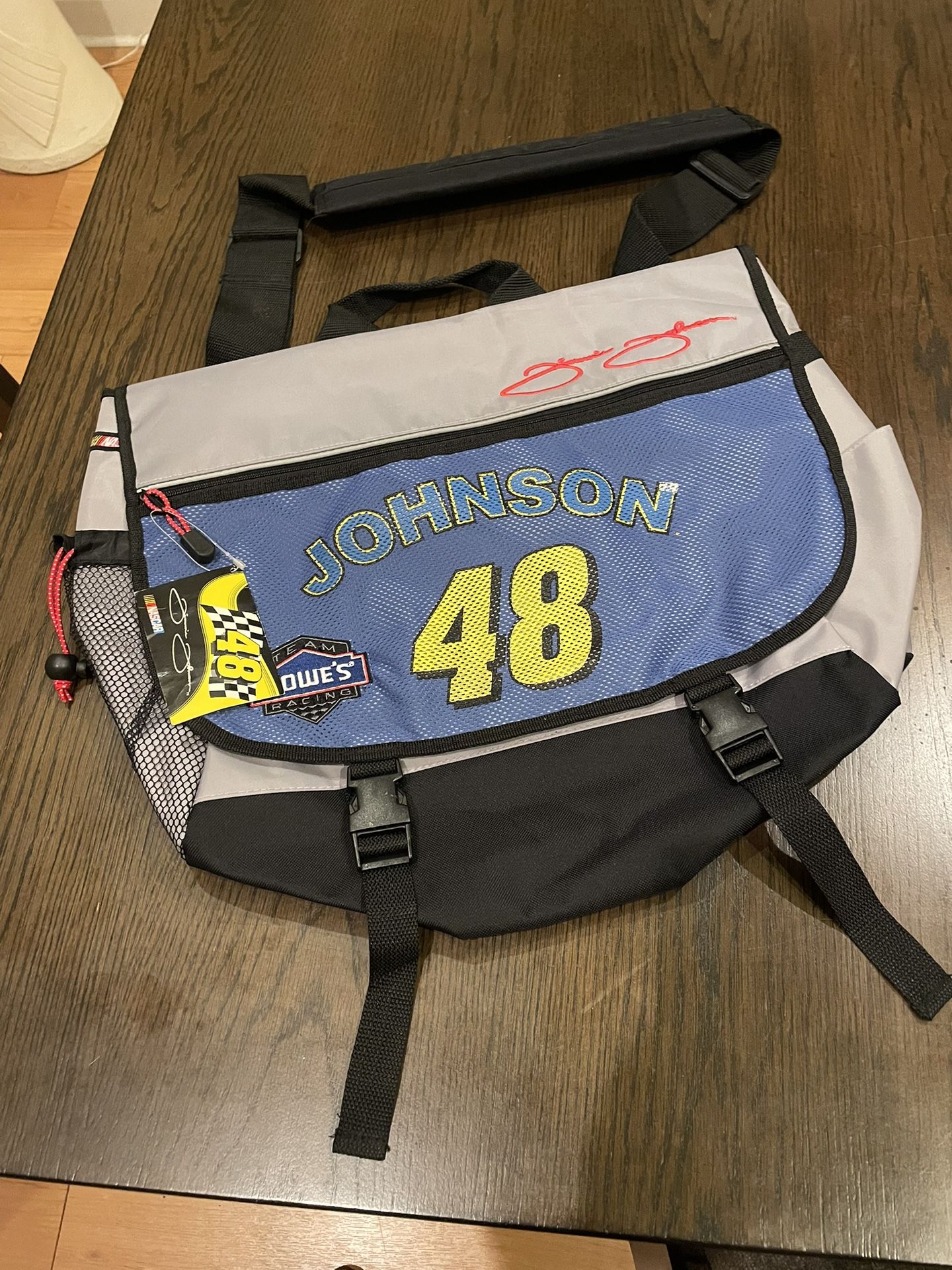 NEW WITH TAGS. Jimmy Johnson #48 Blue Canvas Messenger Duffle Bag Sports Bag NASCAR 2005. Only the N in Johnson is a bit faded