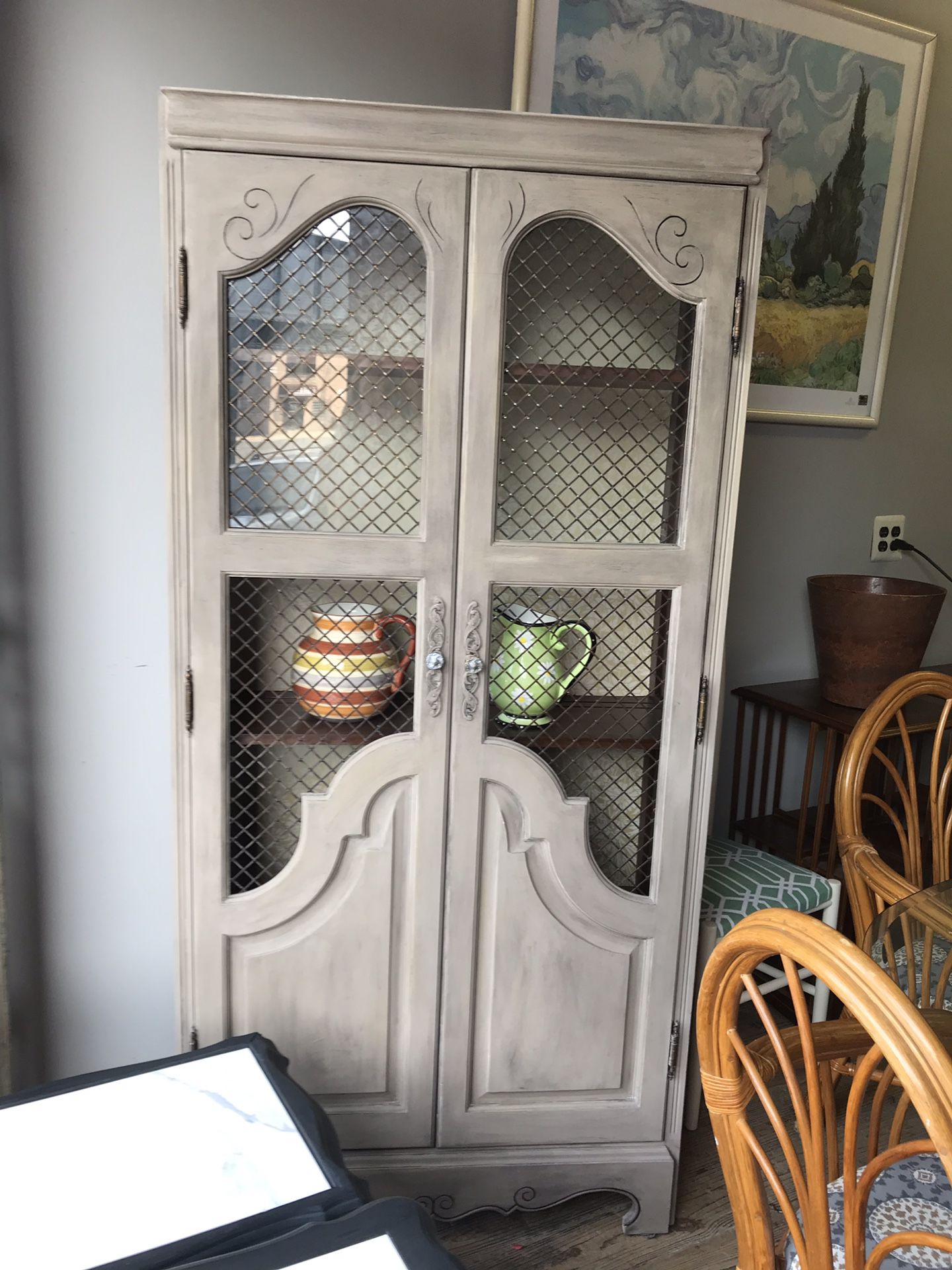 Antiqued display cabinet with shelves and light. Wire mesh doors. $525