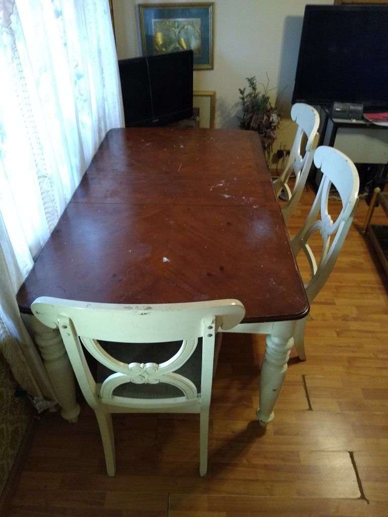 WOOD TABLE WITH 3 CHAIRS...(WITH POSSIBILITY OF 2 MORE CHAIRS)