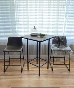 Wooden table and leather chairs
