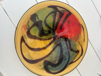 This striking piece is a vintage hand-blown art glass platter or bowl produced by Viz Glass Inc., a glass studio