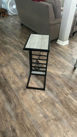 Nice table, you can plug your phone into or a lamp has a plug within it