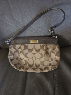 2 coach wrist bags $ 25 each