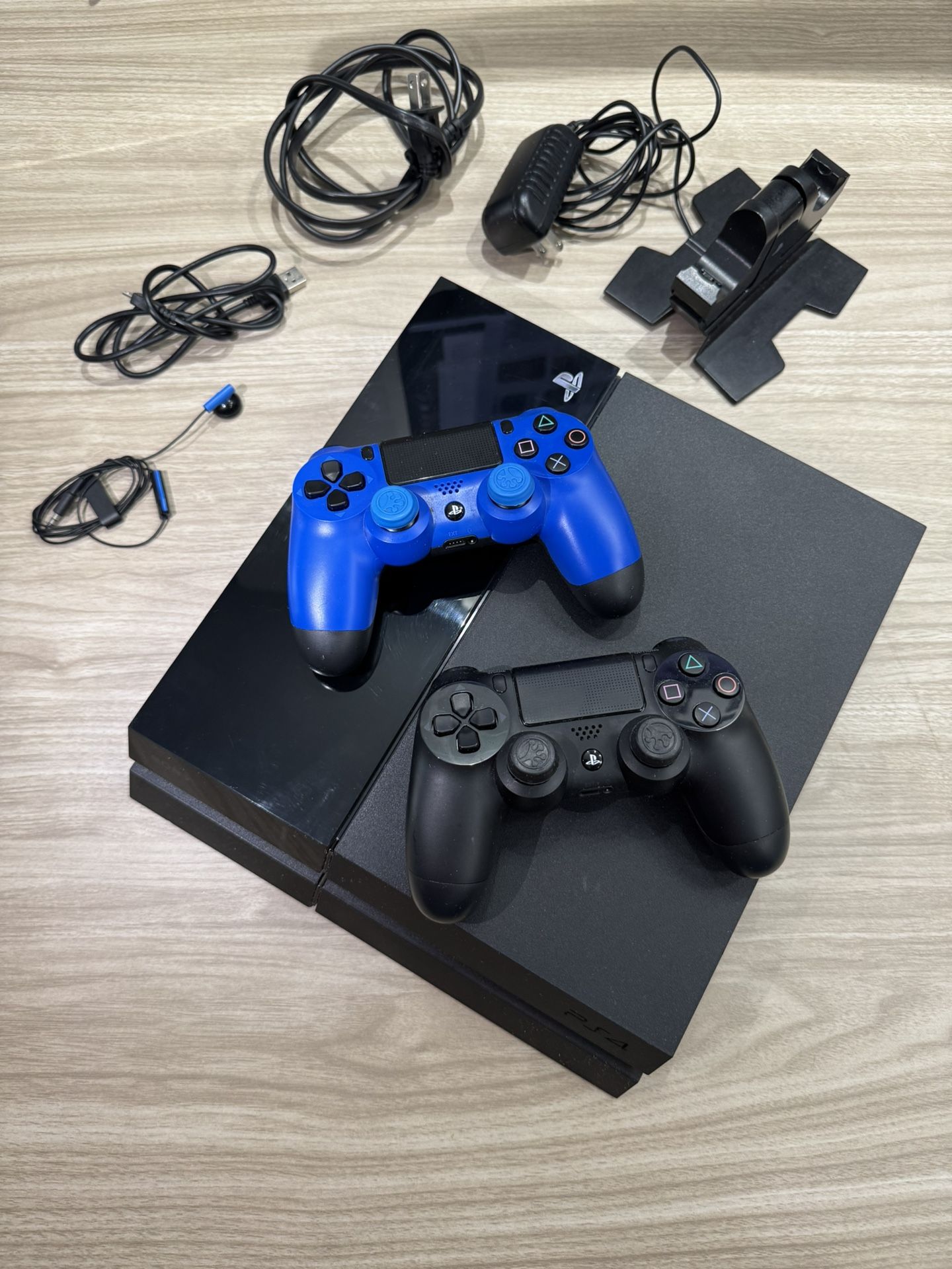 PlayStation 4 (PS4) + 2 Controllers + Dual Charging Dock + Cables – Ready to Play