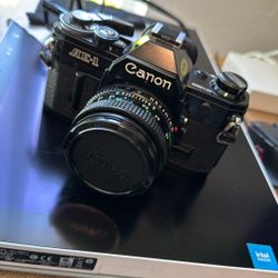 Canon AE-1 Black 35mm Film Camera With Canon nFD  50mm F1.8