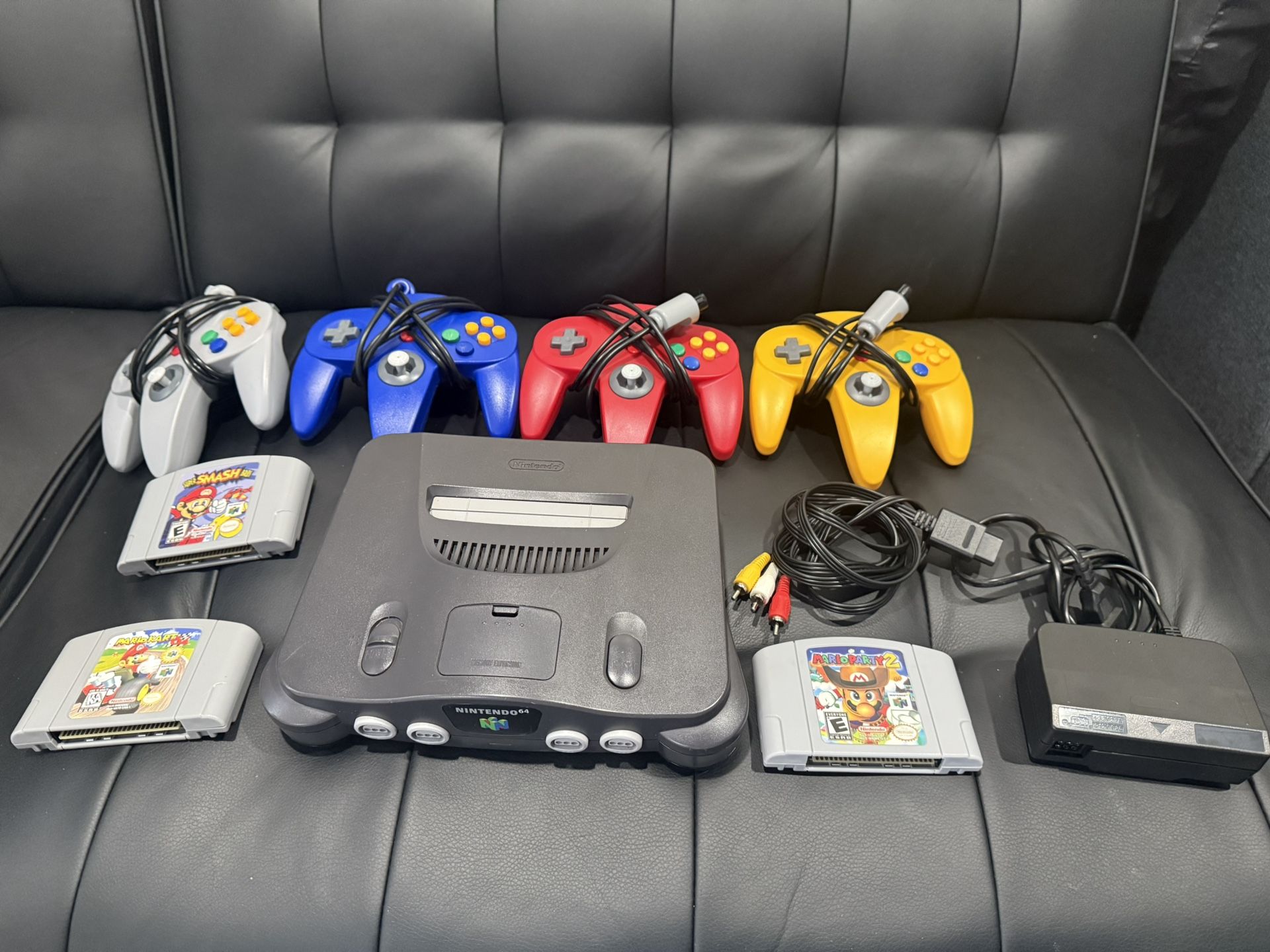 Nintendo 64 W/ 4 Controllers And Games ( Mario Kart 64, Super Smash Bros., Mario Party 2)