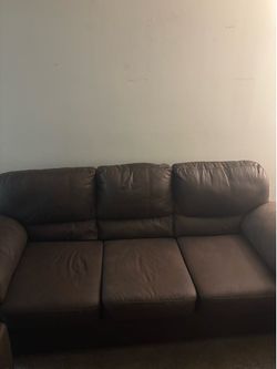 Brown sofa, loveseat, and recliner