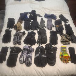 Lots of pairs of adult gloves and some ski goggles