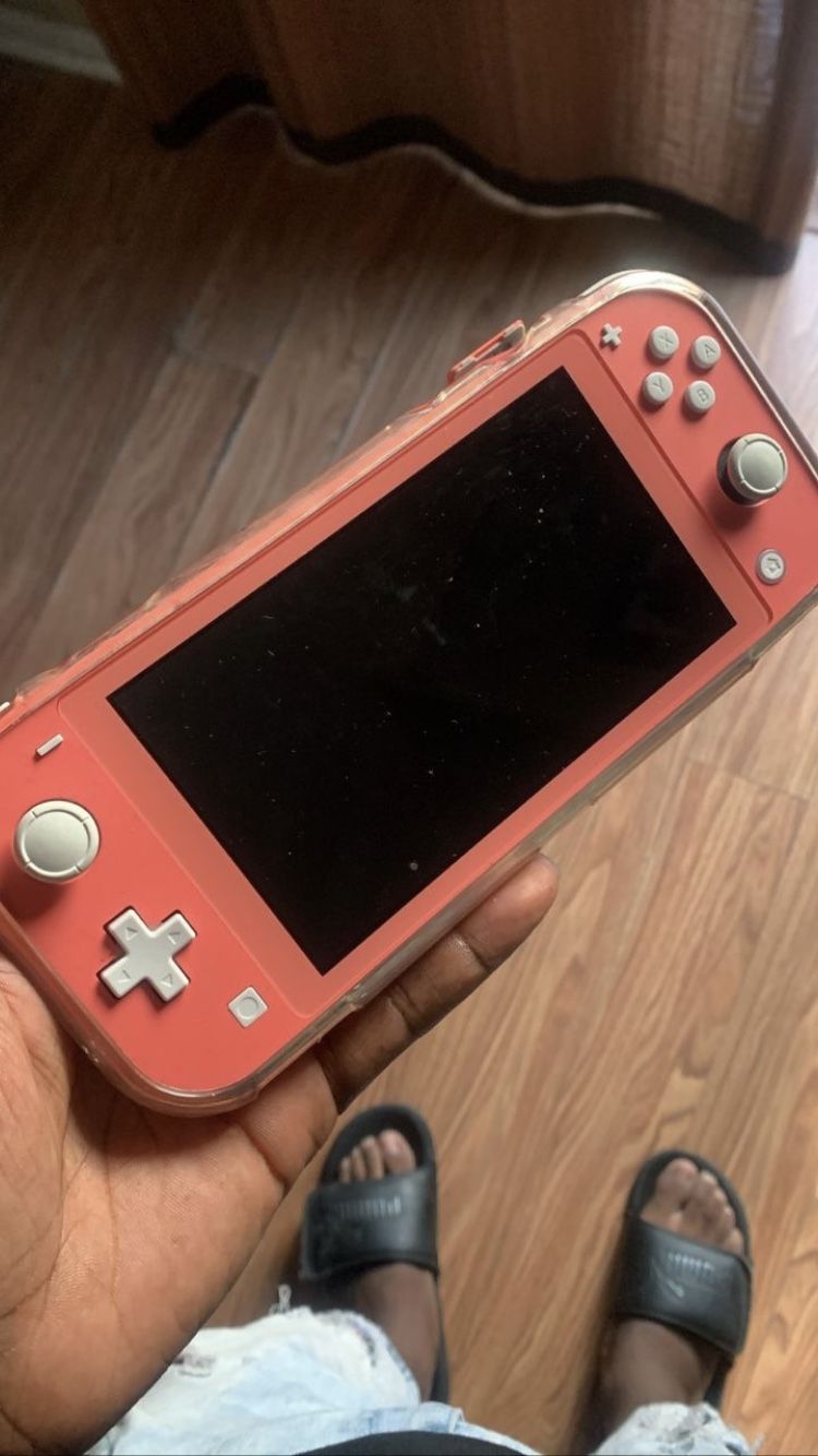 Nintendo Switch Lite With Clear Case and games already on it