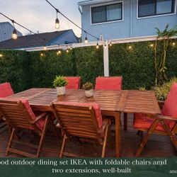 All wood outdoor dining set IKEA with foldable chairs and two extensions, well-built and sturdy.