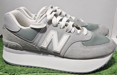 New Balance 574 sneakers, a modified version of the classic 574 featuring a stacked platform sole.Colorway: They are the "Shadow Grey" colorway.Materi